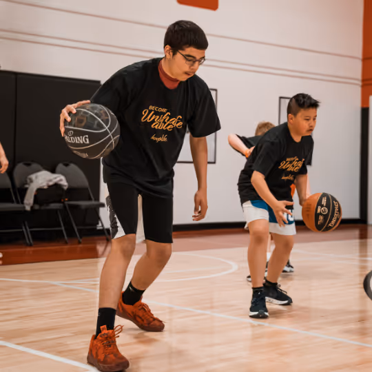 Kids practicing dribbling