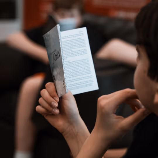 Kid reading a bible